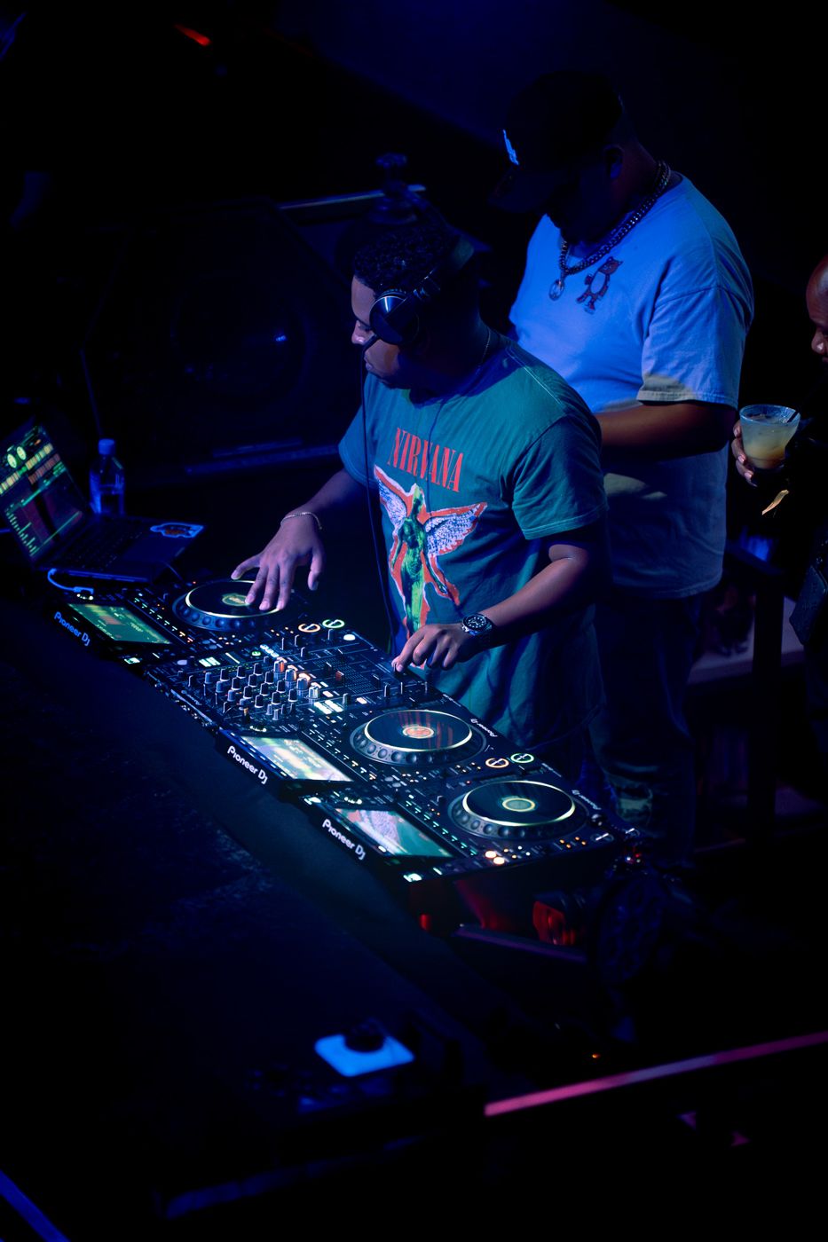 DJ Jay-D at the decks in a nightclub